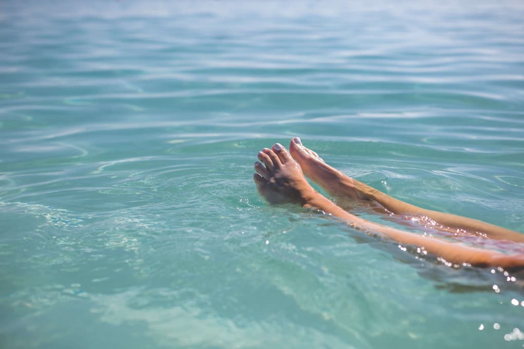 feet-floating-in-blue-water.jpg